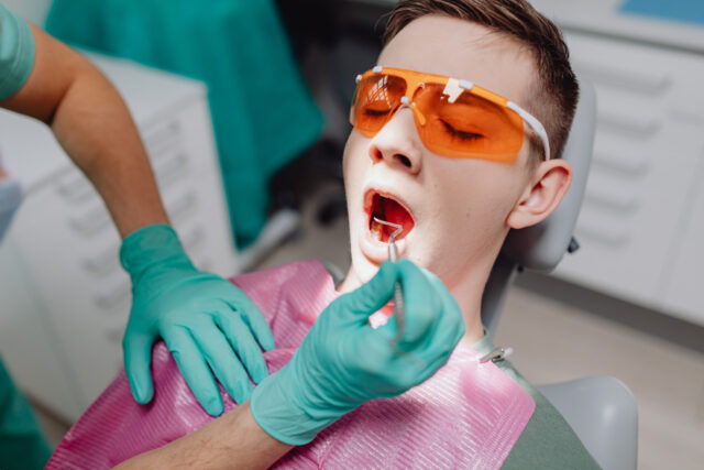 Dentist placing a dental crown on a patient