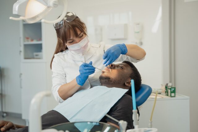Dentist checking a patient during consultation