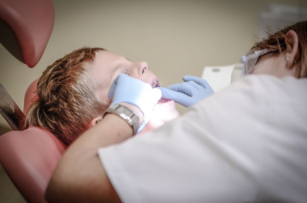 Dental implants phoenix; kid with the dentist