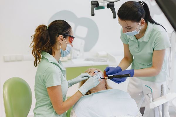 Dentist near phoenix; two dentists with a patient