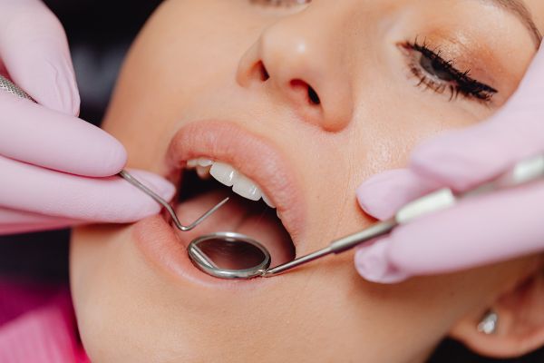 Dentist near phoenix; dentist checking teeth of a patient